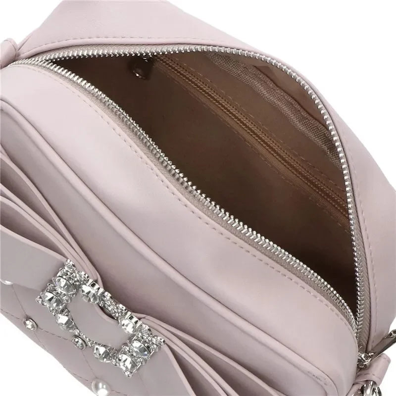 Interior of the crossbody bag showing the lining and the zip pocket