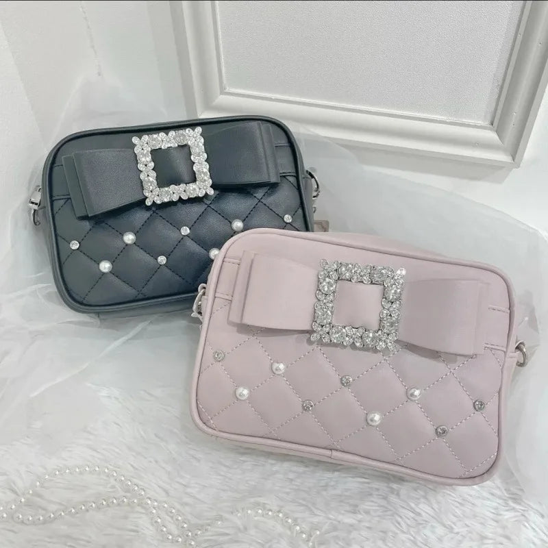 Black and blush quilted crossbody bags styled together